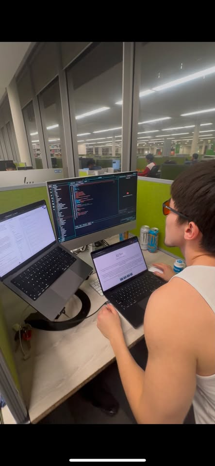 Khuselee working at a university library desk